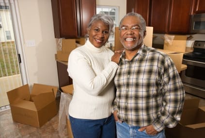 older couple packing for a move older couple packing for a move
