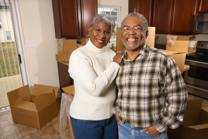 older couple packing for a move